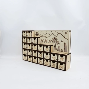 Macro detail of wooden Advent calendar drawers with engraved nativity silhouettes