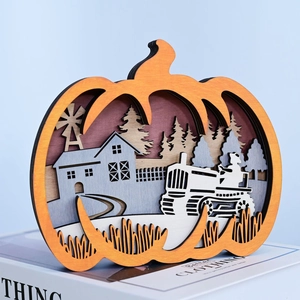 3D multi-layered wooden pumpkin ornament featuring a detailed laser-cut farm harvest scene