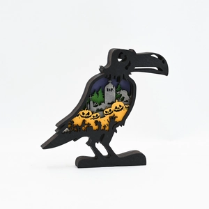 Halloween crow silhouette wood craft with layered graveyard scene and pumpkin decorations