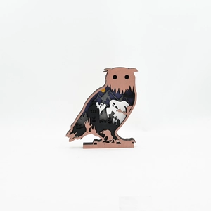 Detailed layered wood carving of owl featuring a spooky Halloween graveyard scene