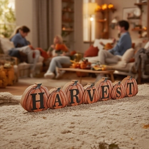 Detail of wooden pumpkin harvest sign with warm lighting on a cozy soft carpet