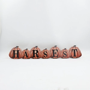 Detailed view of harvest pumpkin wood tabletop decor with harvest letters for thanksgiving