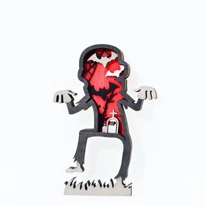 Detailed layered wooden Halloween zombie sculpture with RIP headstone and bat motifs