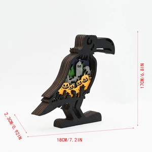 Detail of 3D multi-layer laser cut wooden crow with pumpkin and graveyard scenes