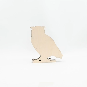 Detail view of owl silhouette wood carving with laser cut edges for Halloween decor