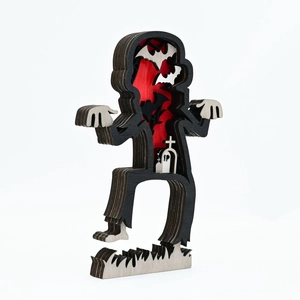 Detailed side view of 3D multi-layer wooden zombie carving with cemetery and bats