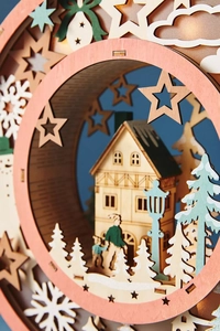 Detailed side view of multi-layer laser-cut wooden Christmas LED light scene