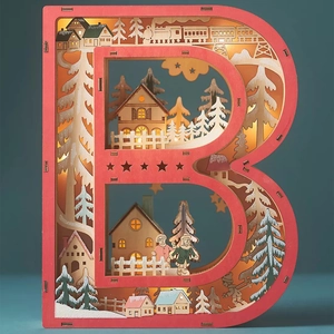 Detail of wooden letter B LED light with multi-layer carved winter scene and warm glow
