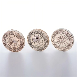 Three-piece set of wooden circular ornaments featuring laser-cut Islamic moon and star patterns