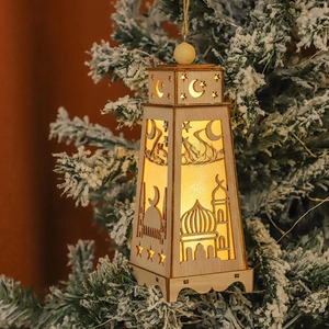Detail of wooden Eid lantern with warm LED light, mosque cutout and EID lettering