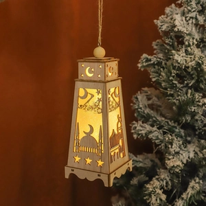Close-up of wooden Ramadan lantern with LED lights featuring mosque and moon cutouts
