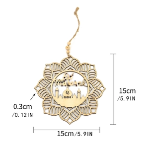 Detail of wooden Eid Mubarak ornament with intricate cutout patterns and jute hanging rope