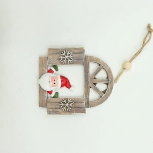 Detail of wooden Christmas ornament with Santa Claus figure and snowflake accents