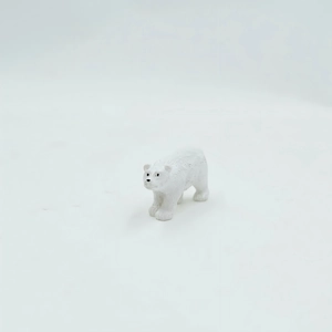Detailed macro shot of a white polar bear miniature for micro landscape DIY decor