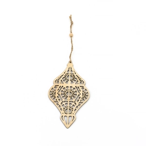Detail of wooden Eid Mubarak star pendant with laser-cut geometric patterns and jute rope