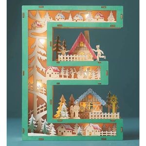Detail of letter E wooden LED light with hollow winter village scene and warm glow