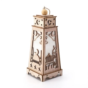 Close-up of wooden Eid lantern with LED light, laser-cut stars and moon patterns