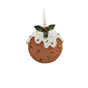 Christmas pudding tree ornament with white icing and holly leaves on white background
