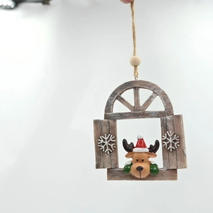 Detail of a resin Christmas reindeer window ornament with faux wood texture and hemp rope