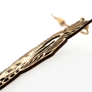 Detailed close-up of laser-cut wooden lantern ornament with intricate geometric patterns