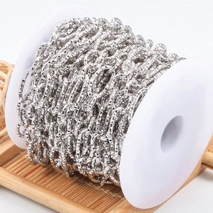 Diamond-cut stainless steel O-chain for DIY jewelry making on a white plastic spool