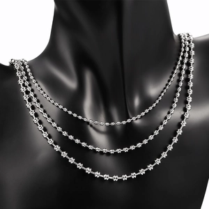 Three-layer silver stainless steel beaded necklace with textured spherical beads