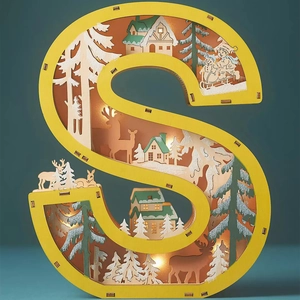 Detail of wooden letter S LED light with hollow carved reindeer and winter cabin scene