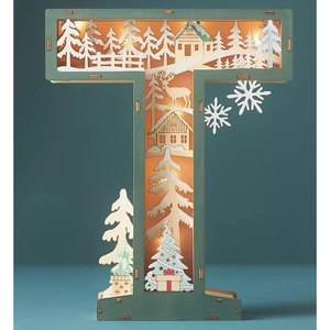 Detail of wooden letter T lamp with LED forest scene and reindeer Christmas decoration