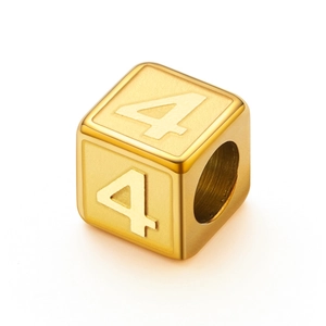 Close-up of golden stainless steel square bead with embossed number four for jewelry
