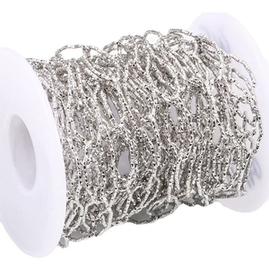 Sparkling stainless steel diamond-cut chain on a white spool for DIY jewelry making