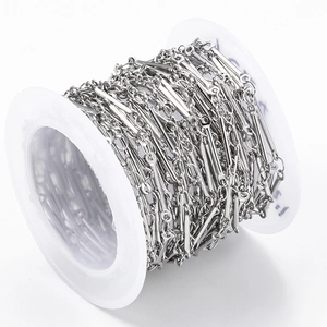 Industrial style silver stainless steel bar and link chain on a white spool for DIY