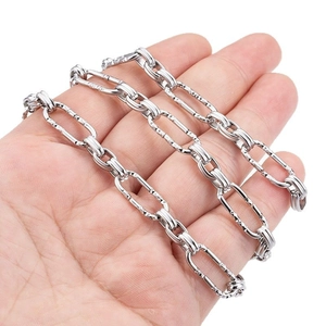 Polished silver stainless steel textured link chain necklace displayed on hand
