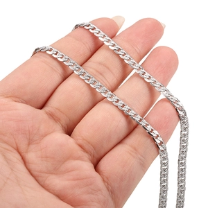 Handheld silver stainless steel Cuban link chain with detailed flat surface polishing