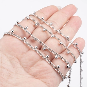 Detailed view of stainless steel ball chain featuring polished metal beads on links