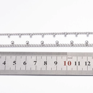 Close-up of stainless steel ball chain with 3mm beads and measurement ruler detail