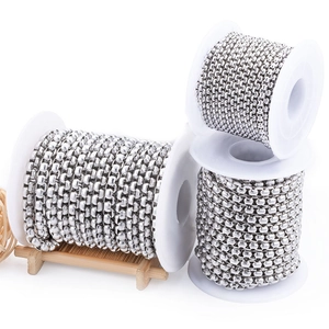 Polished stainless steel box chain spools for DIY jewelry making on a bamboo stand