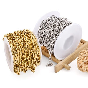 Polished gold and silver stainless steel cross chains on spools for DIY jewelry making