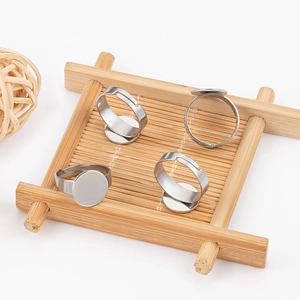 Set of four adjustable stainless steel ring blanks with flat round bases for DIY jewelry