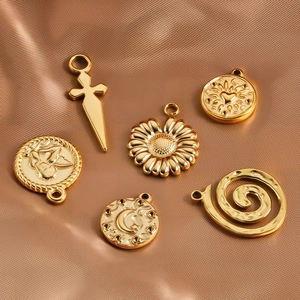 Set of six 18k gold plated stainless steel pendants with heart and floral engraved designs