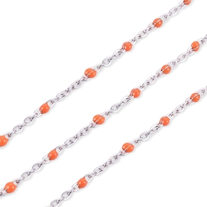 Detail of silver stainless steel chain featuring vibrant orange bead accents