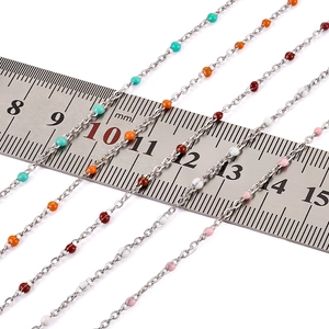 Detail of stainless steel chain with 2mm colorful enamel beads and measurement ruler