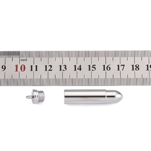 Polished stainless steel bullet pendant with ruler showing 40mm length measurement