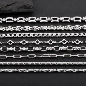 Various types of silver stainless steel chains including Figaro and geometric designs