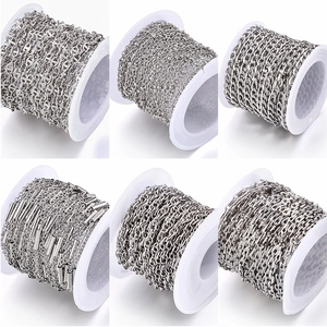Various silver stainless steel DIY chains including ball and anchor links on white spools