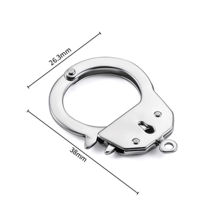 Macro detail of polished stainless steel handcuff clasp with 38mm length measurement