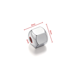 Macro detail of 6mm stainless steel cube bead with 2mm hole for DIY jewelry making
