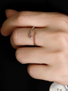 Detail of adjustable S925 sterling silver ring with marquise pink zircon on finger