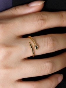 Detail of adjustable silver ring with marquise-cut black gem and pave-set zircons