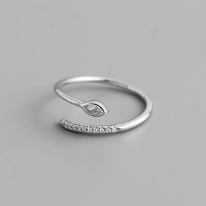 Macro detail of S925 sterling silver ring with marquise zircon and pavé setting