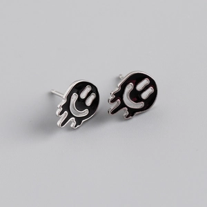 Detailed view of S925 sterling silver stud earrings featuring black enamel dripping smiley faces